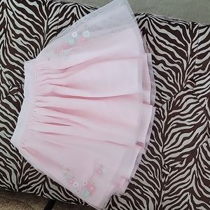 Pink skirt with floral decorations